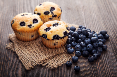 Muffin,With,Blueberries,On,A,Wooden,Table.,Fresh,Berries,And